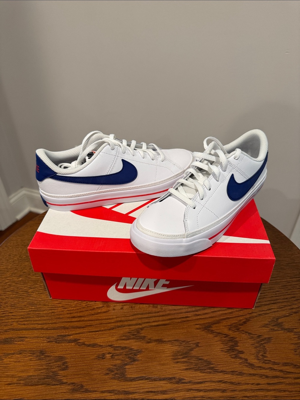 Nike White Low-Top Sneakers with Blue Swoosh